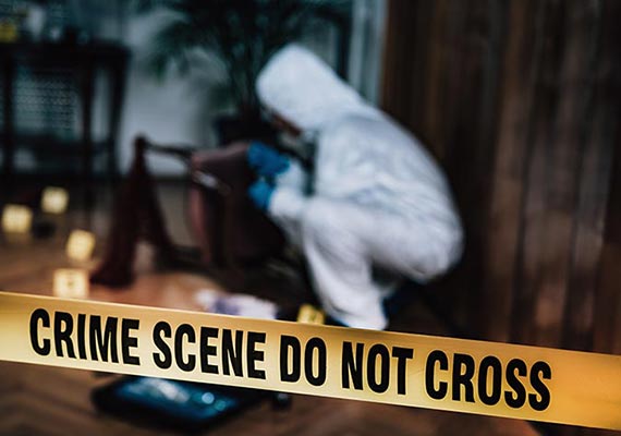Professional worker cleaning crime scene